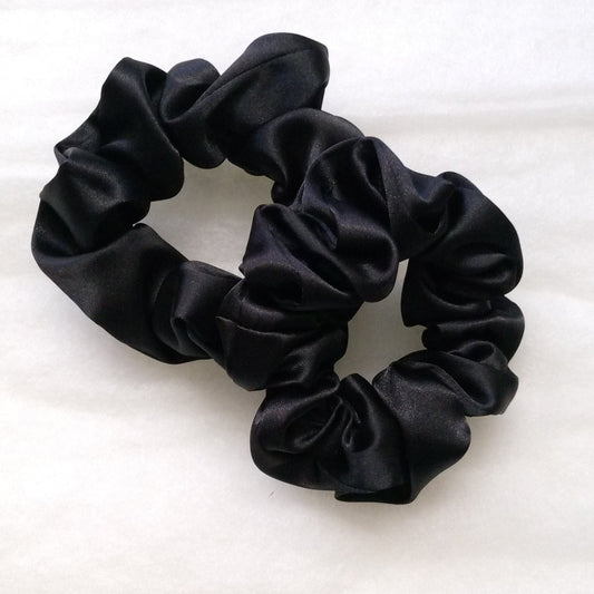 Black scrunchie on a white background